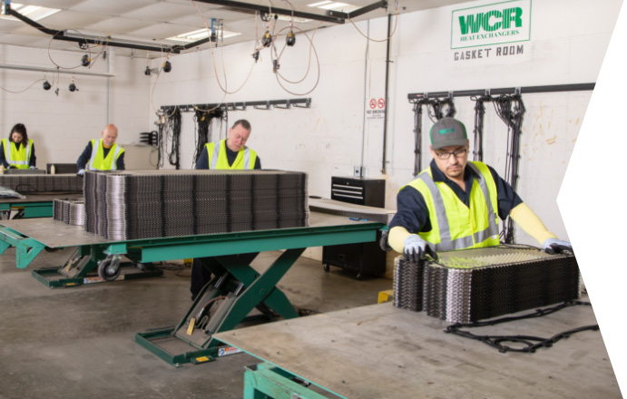 WCR technicians adding gaskets to heat exchanger plates