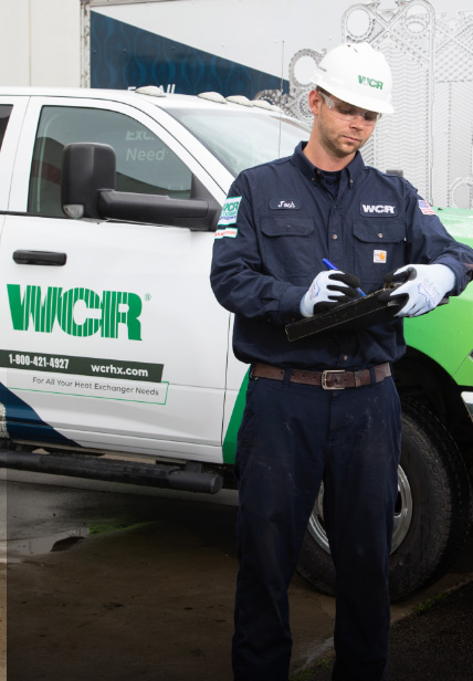WCR Servive Technician standing by truck